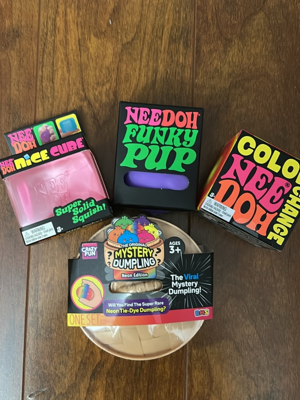 Nee Doh Pink Nice Cube, Purple Funky Pup, Yellow Color Change and 1 DumplingNeon